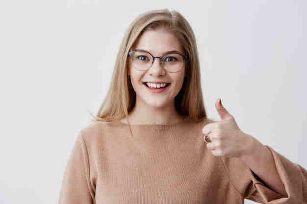 i-like-that-great-job-happy-young-blonde-female-wearing-casual-long-sleeved-sweater-making-thumbs-up-sign-smiling-cheerfully-showing-her-support-respect-someone-body-language_176420-13156.jpg